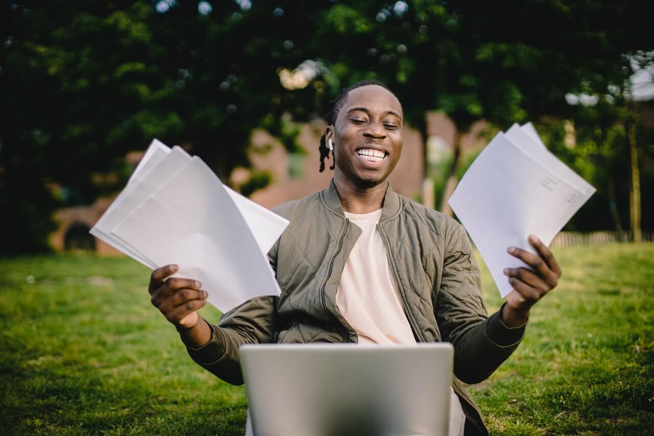 a person holding a laptop